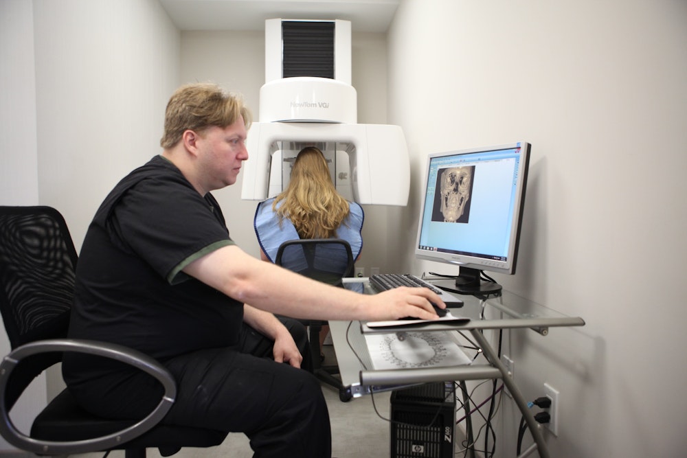 Dr. Golan taking a panoramic x-ray of a patient