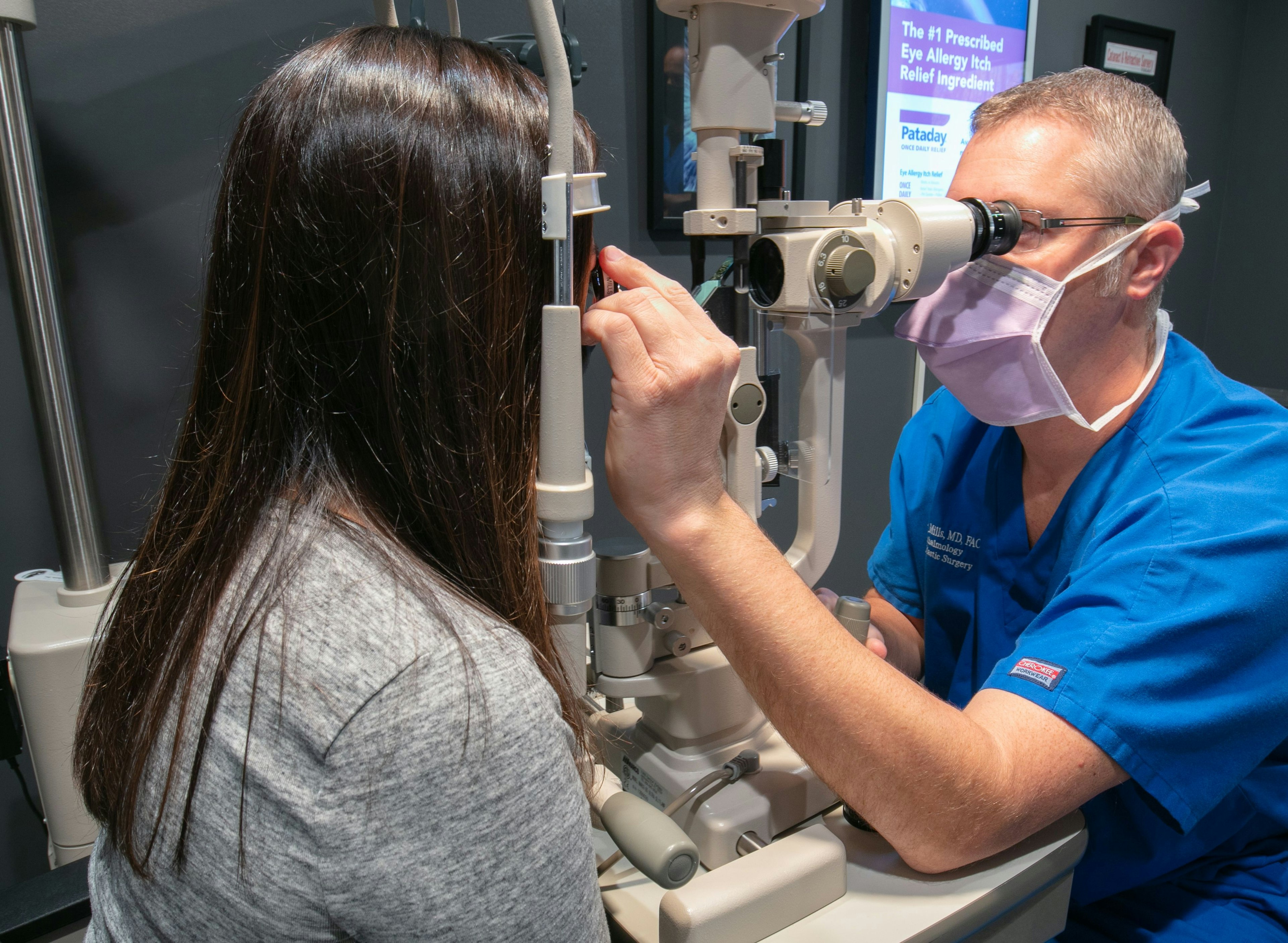 Ophthalmologist David Mills with patient