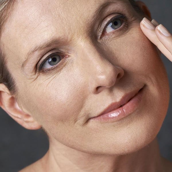 Woman touching her face