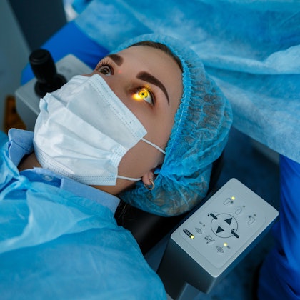Woman undergoing laser vision correction surgery