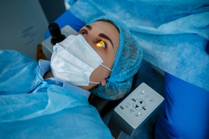 Woman undergoing laser vision correction surgery