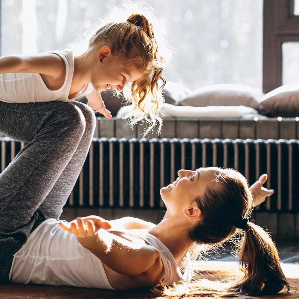 Woman playing with her child