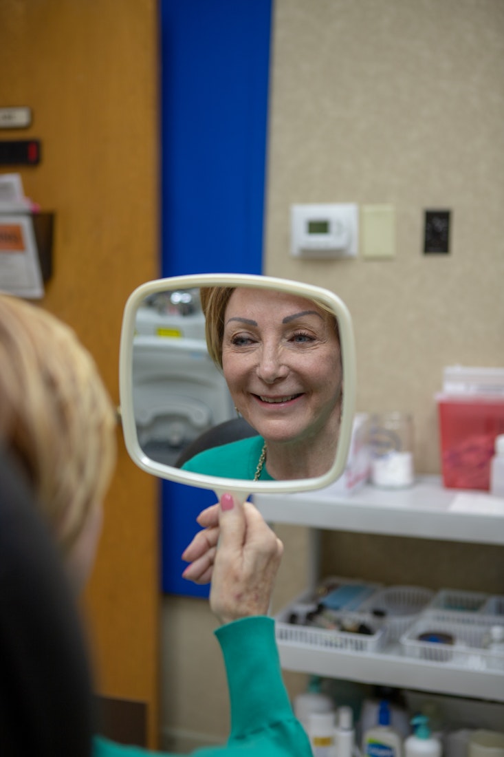Real patient looking in the mirror