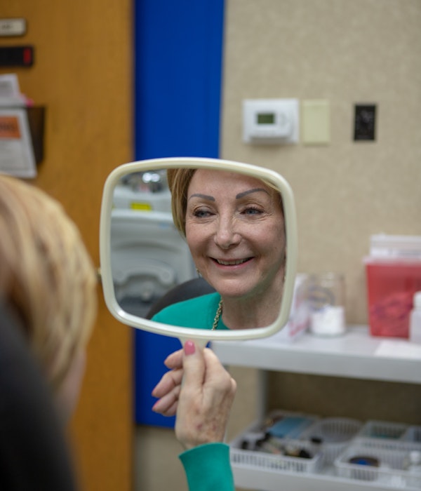Woman looking in mirror