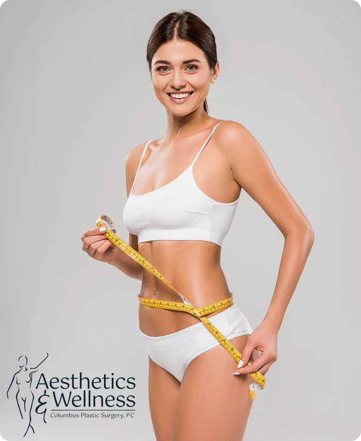 Woman measuring her waist and smiling