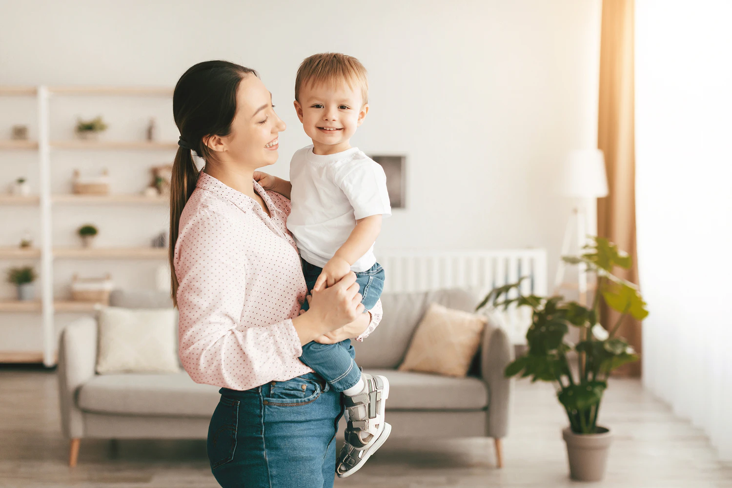 Woman carrying small child