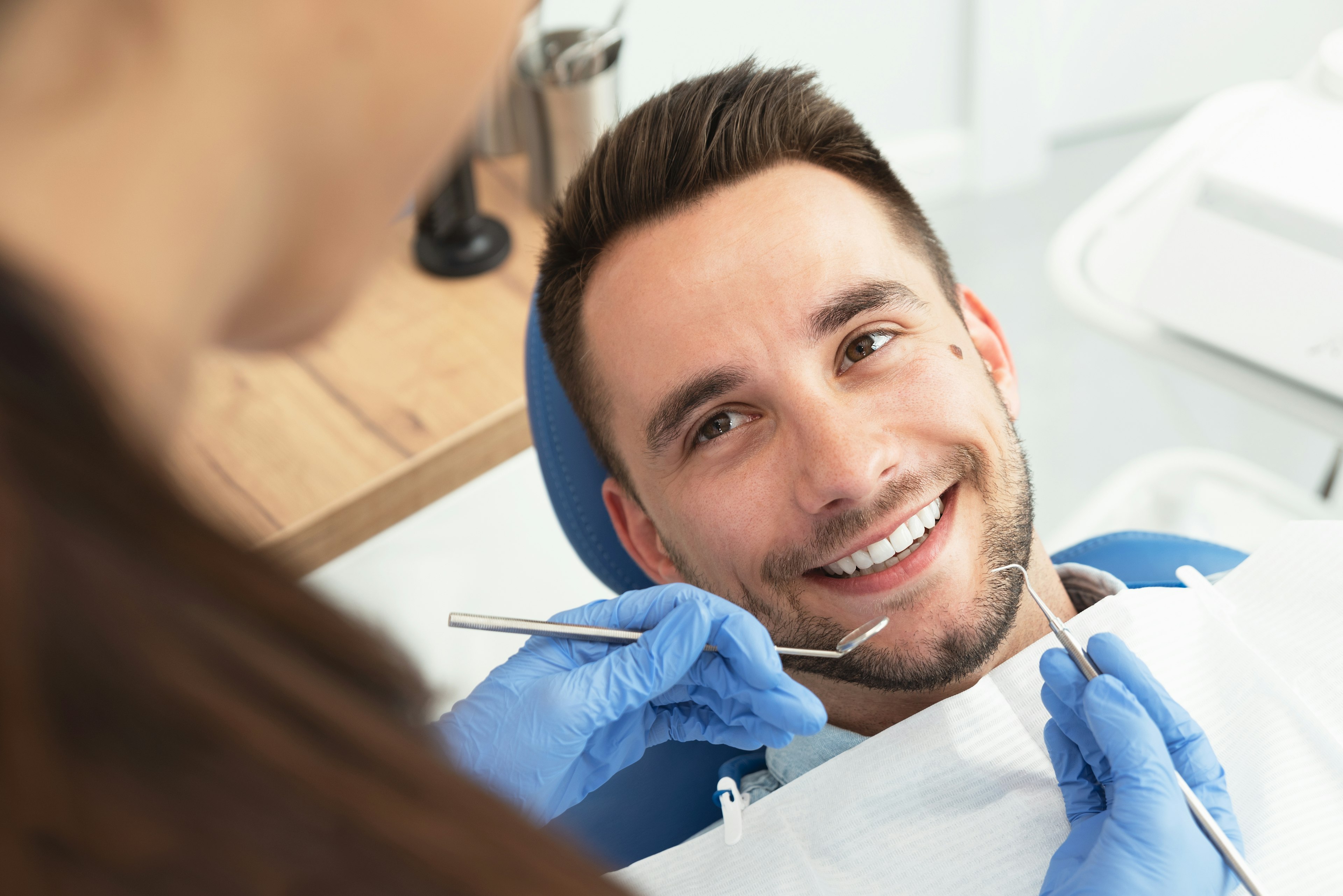 Patient smiling at dental hygienist