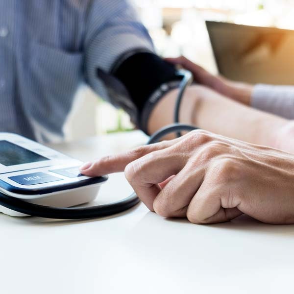 Close-up of a person getting their blood pressure taken