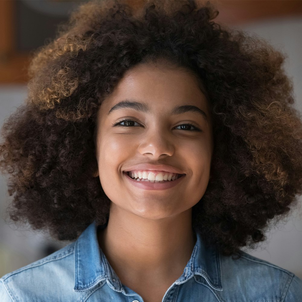 Smiling young woman after wisdom tooth removal