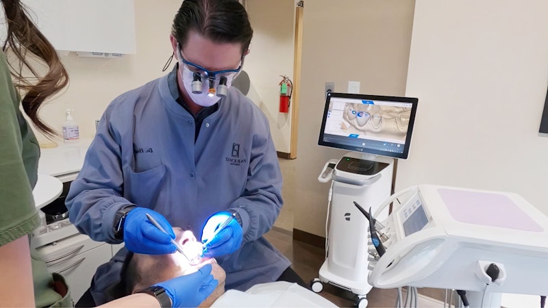 doctor working on patient's teeth