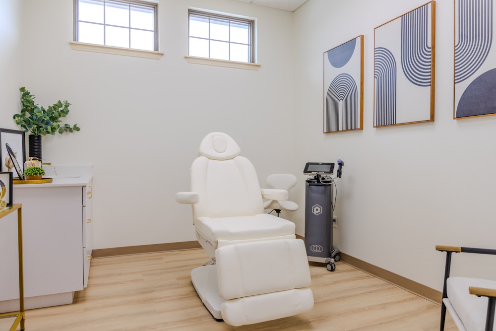 Treatment room with a white patient chair and modern decor at the Denton office
