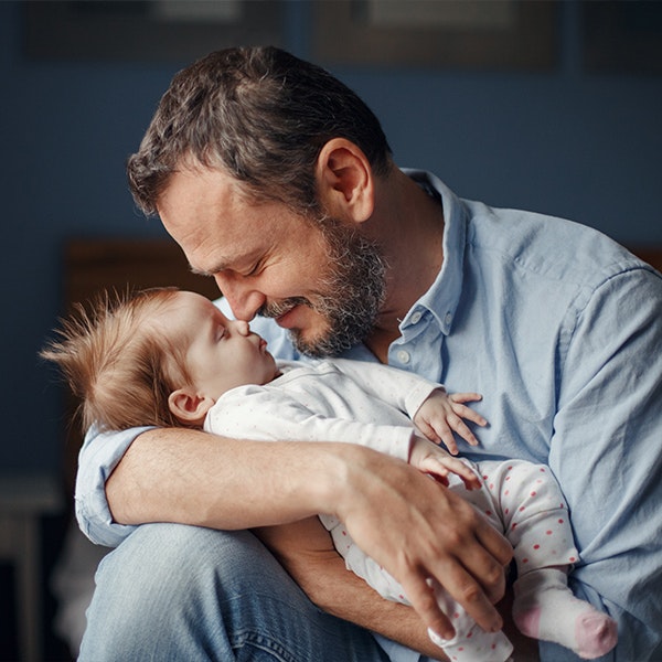 a man holding a baby