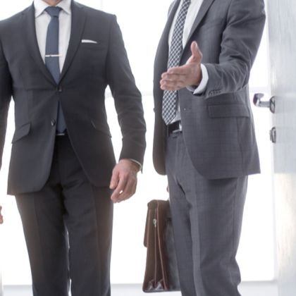 Two businessmen walking together
