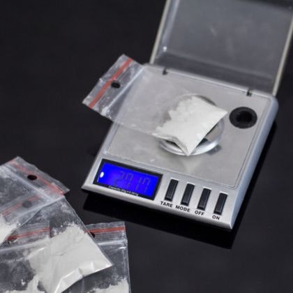 Bags of powder weighed on a digital scale