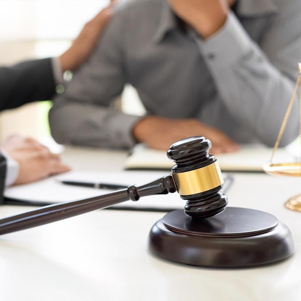 Lawyer comforting client