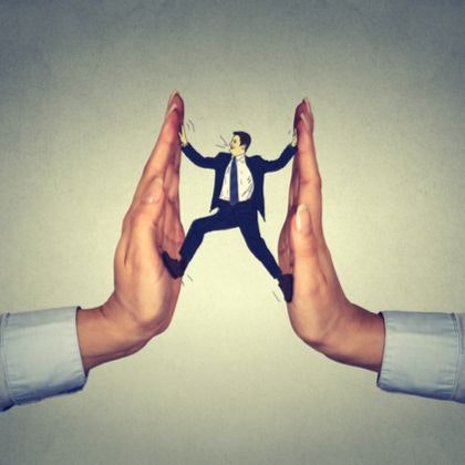 Man between two hands