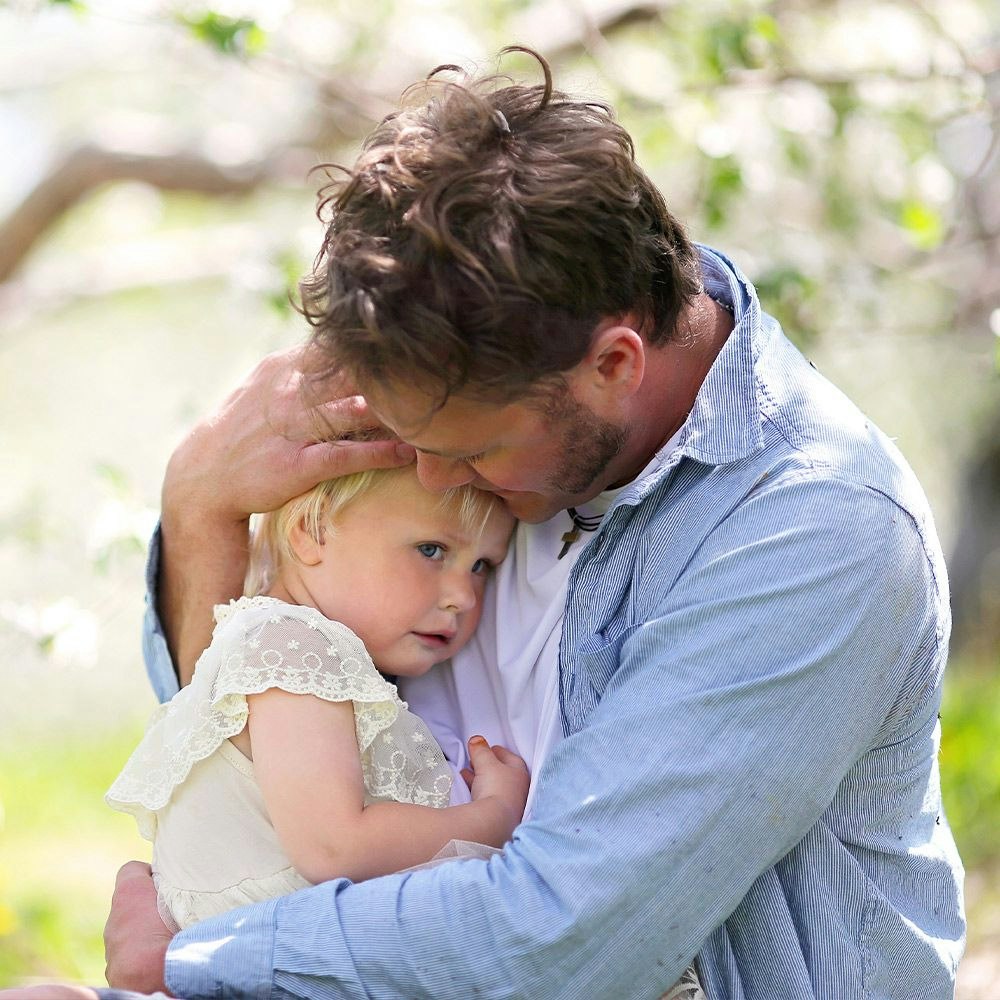 Father comforting small girl