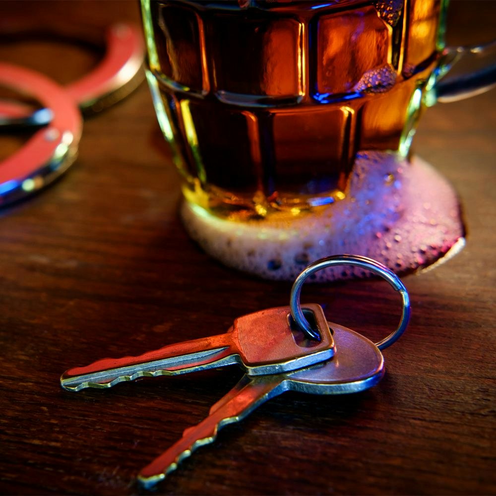 Car keys and alcoholic beverage