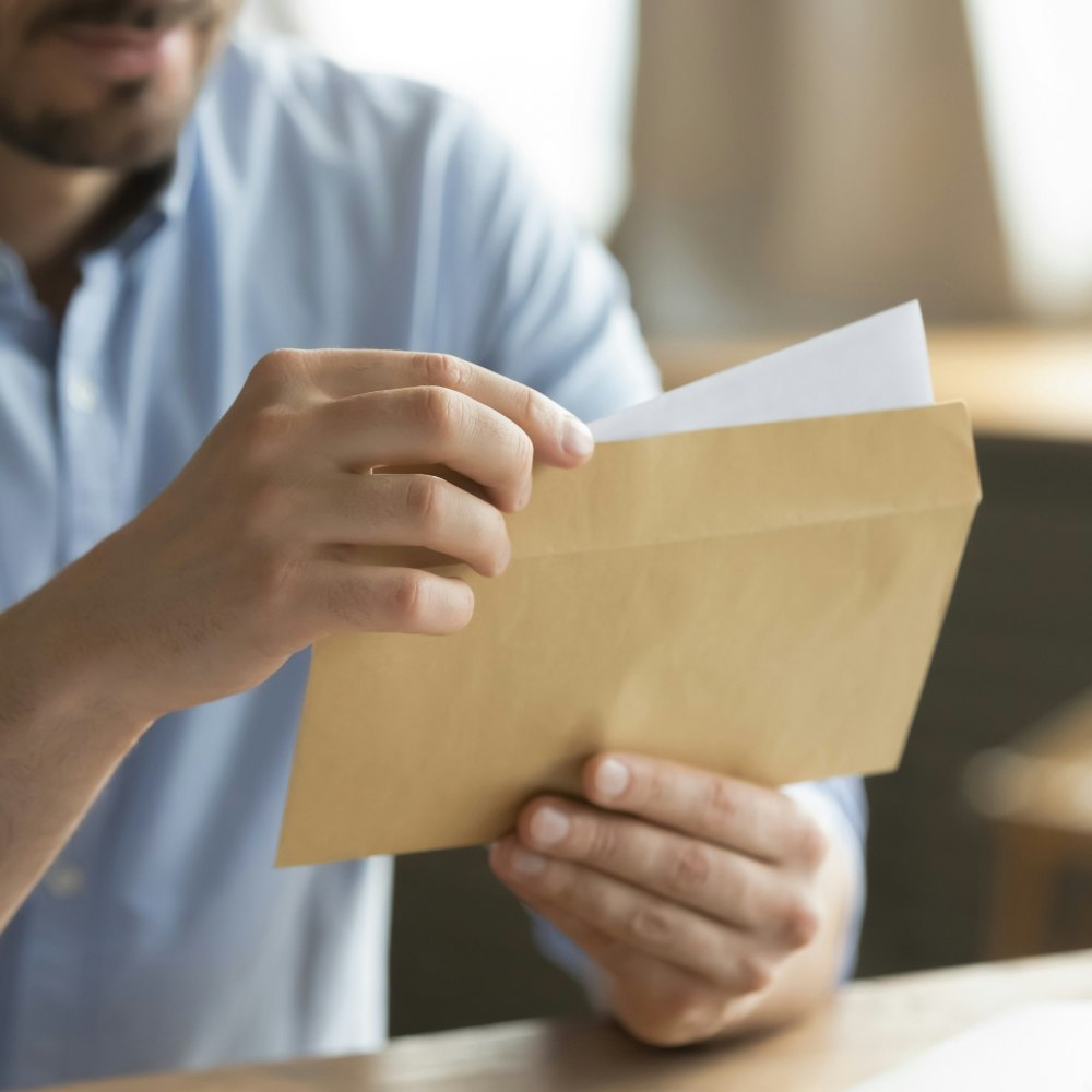 Man opening envelope
