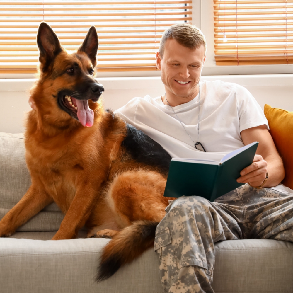 Military man at home with dog