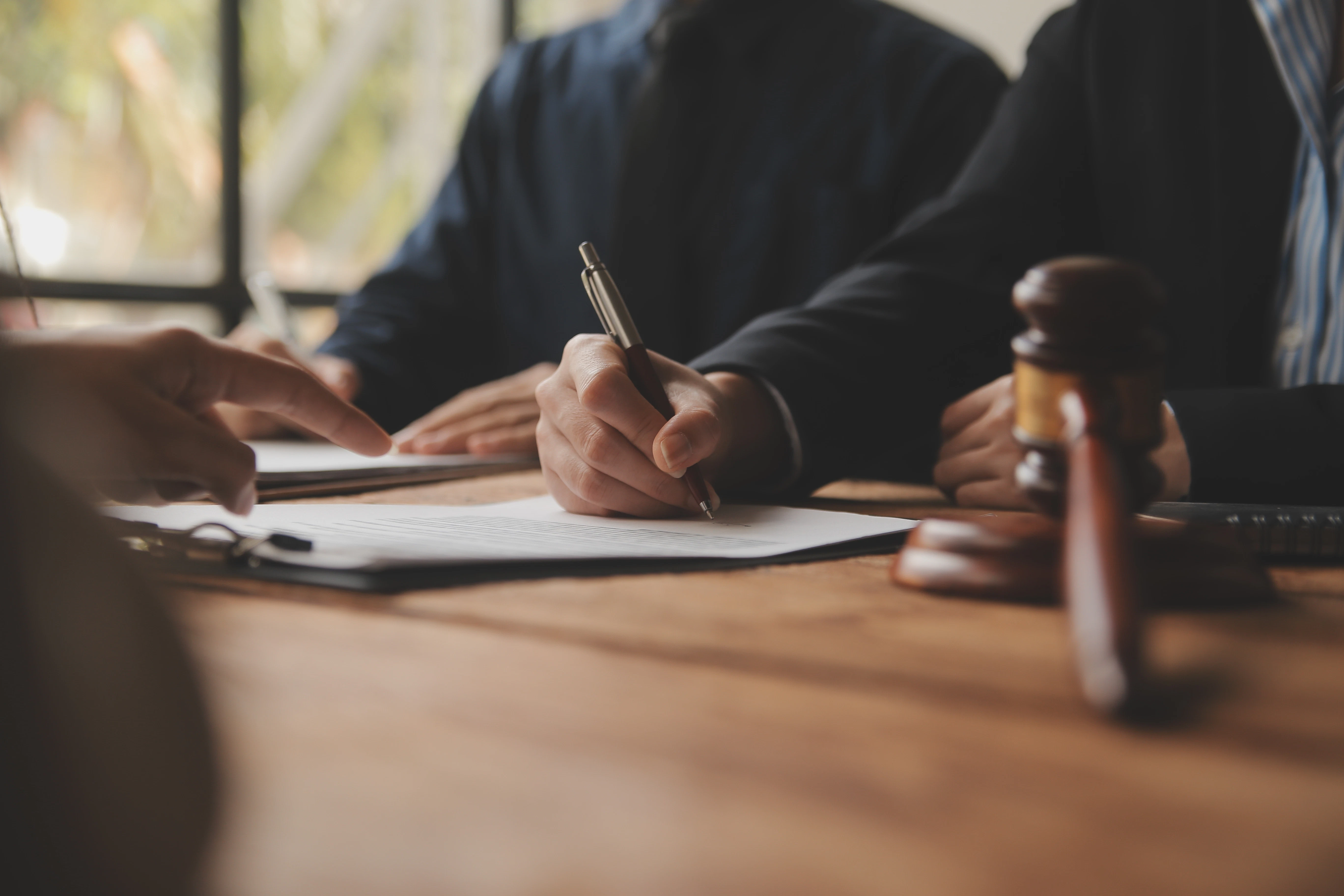 Attorneys doing paperwork w/ client