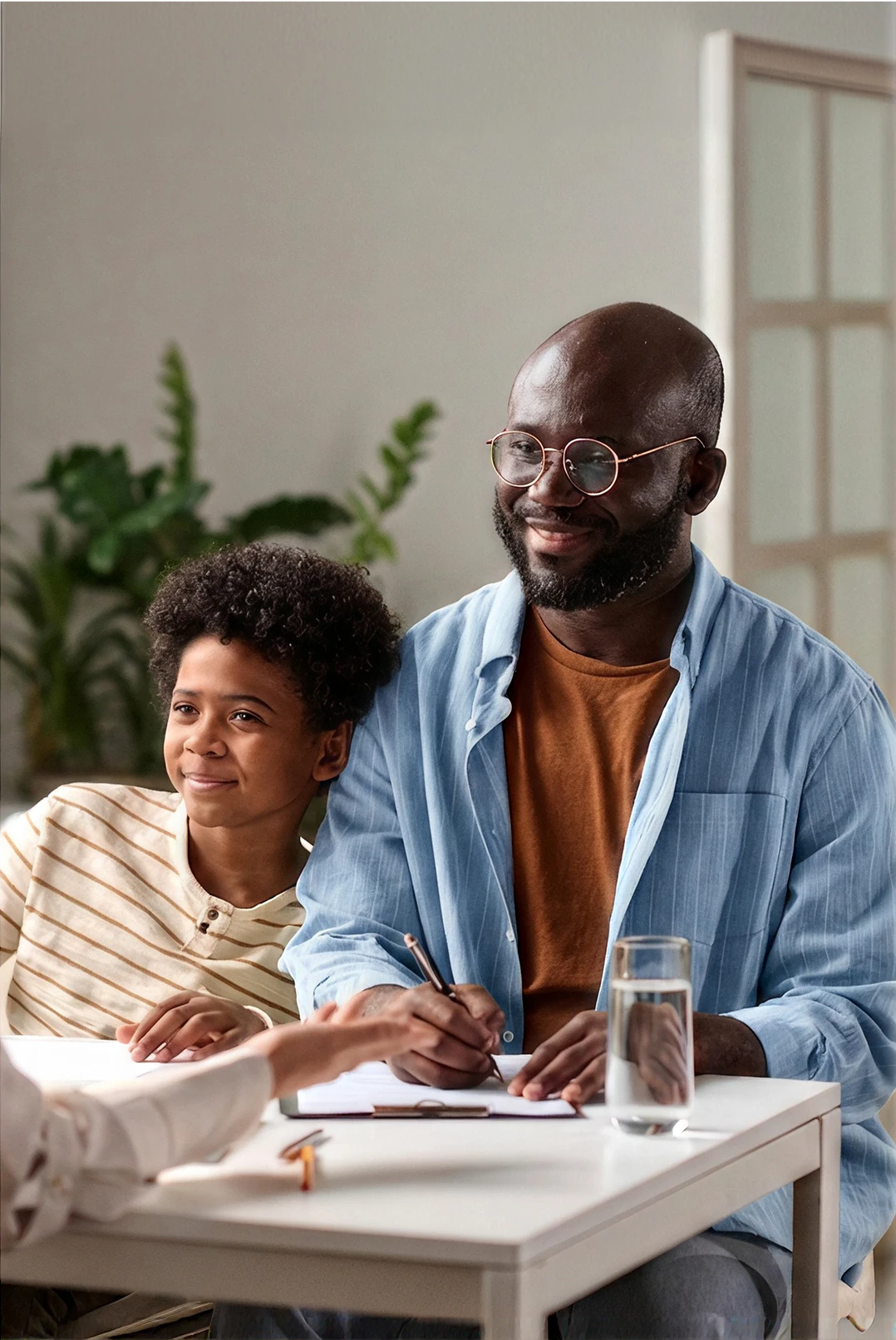 Father and son smiling