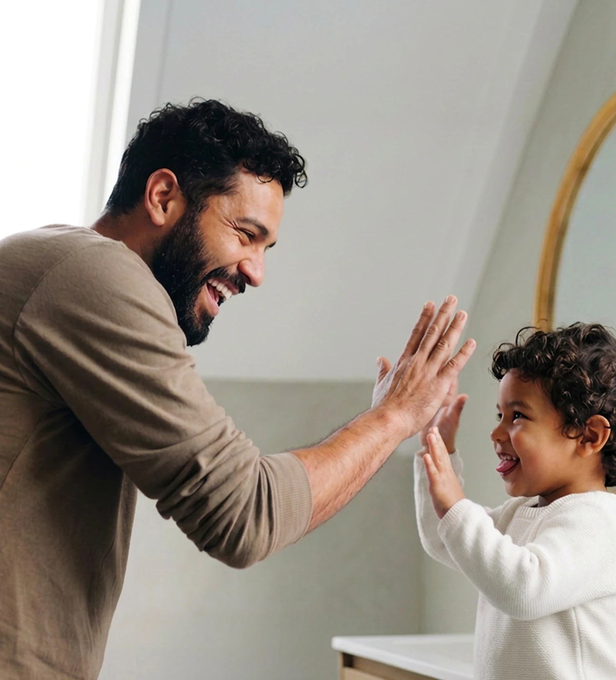 father and son high-fiving