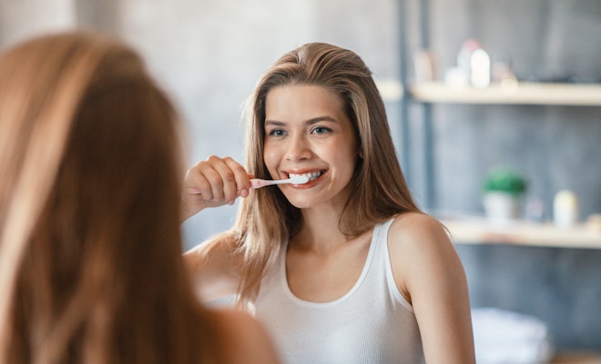 Woman brushing her teeth