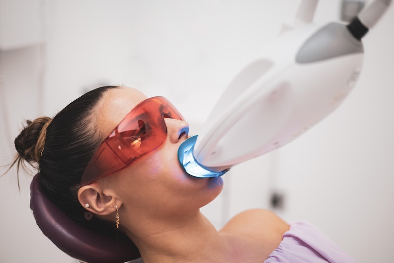 Woman getting in-office whitening treatment