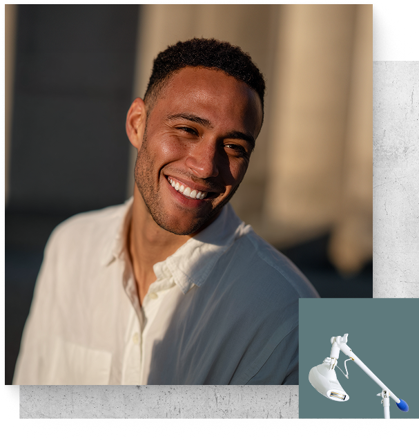 Man smiling with a professional whitening device in bottom corner