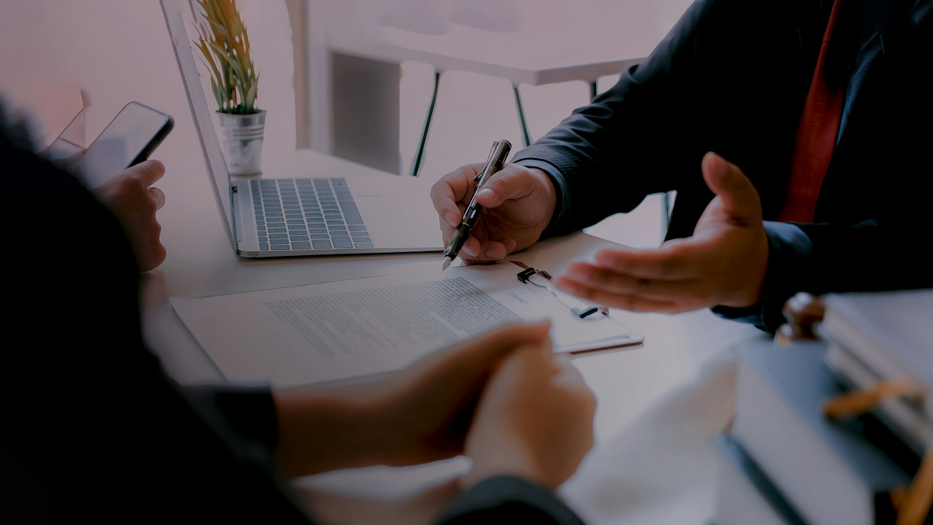 Two men working on paperwork