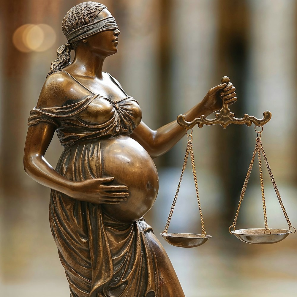 Pregnant statue of lady justice