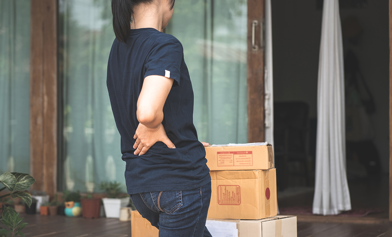 Woman holding back in pain