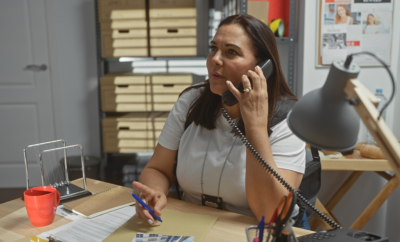 stressed woman on the phone in office