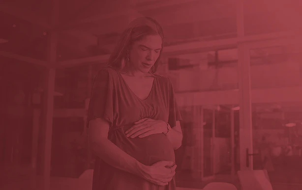 pregnant woman holding her stomach