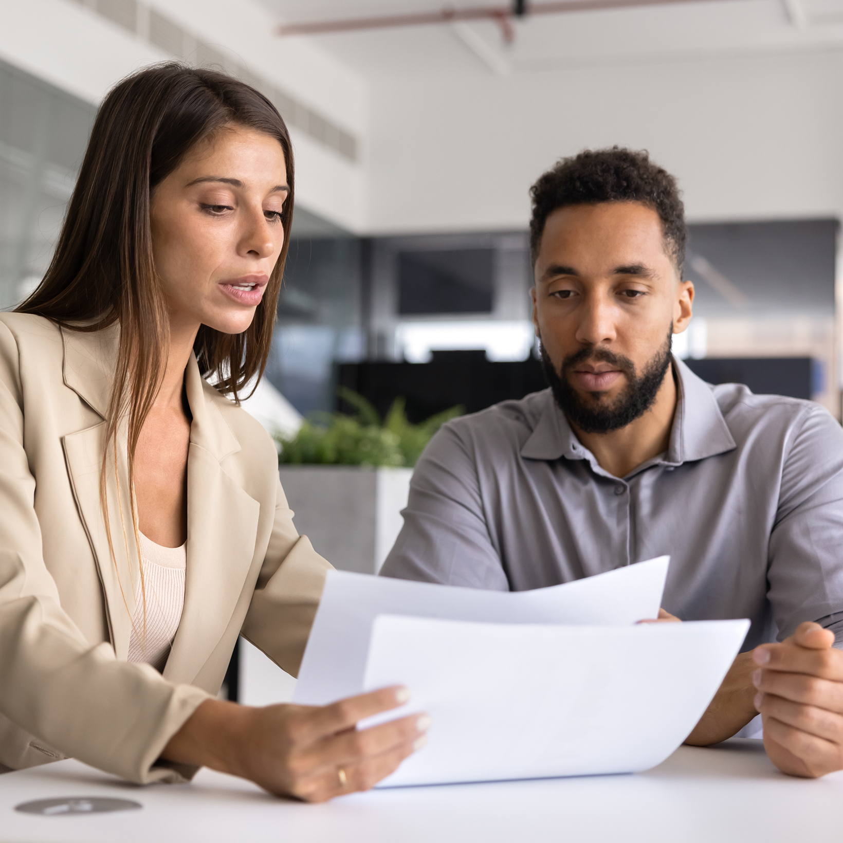 woman going over paperwork w/ a man
