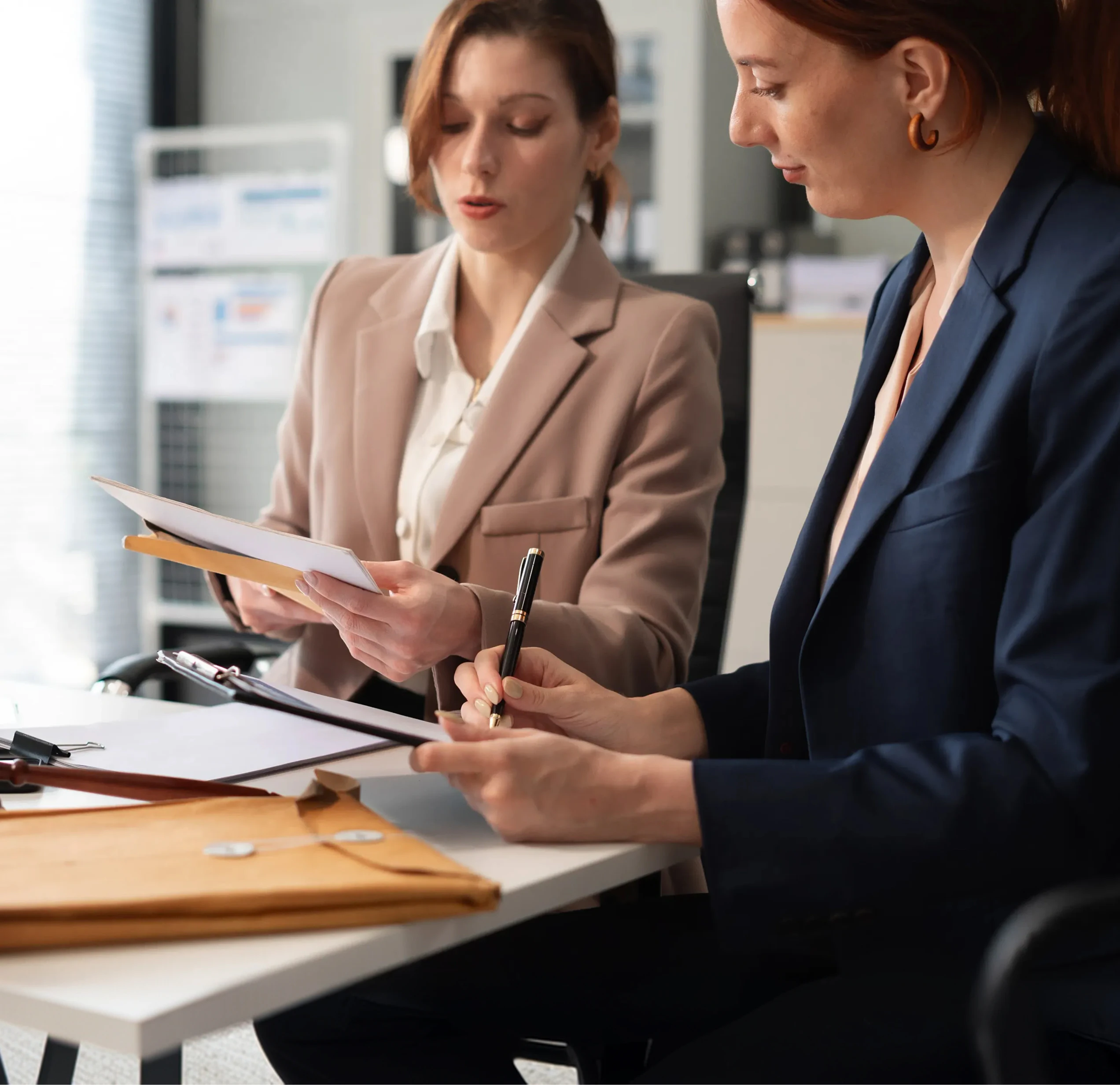 two women going over paperwork