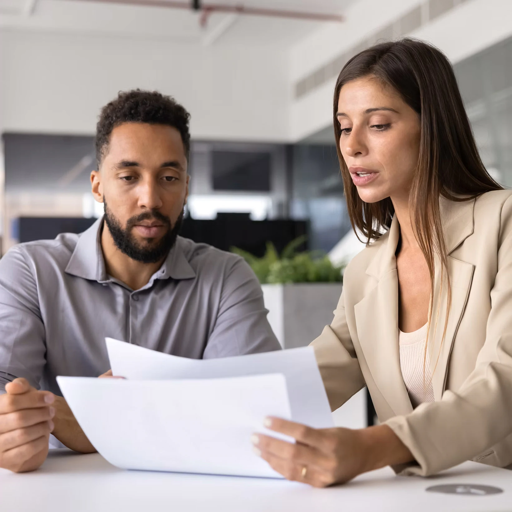 woman and man looking over paperwork