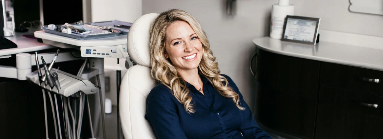 young blonde woman smiling in Clint Newman DDS exam room
