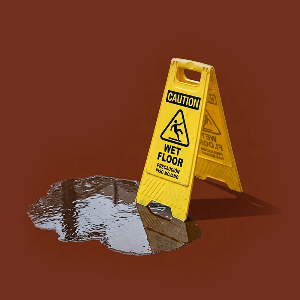 Wet floor sign and puddle