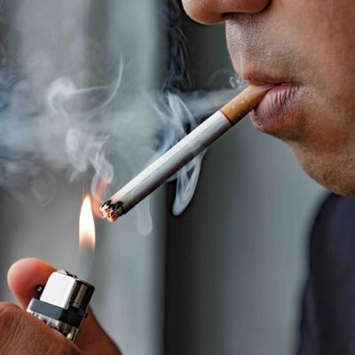 Man lighting a cigarette