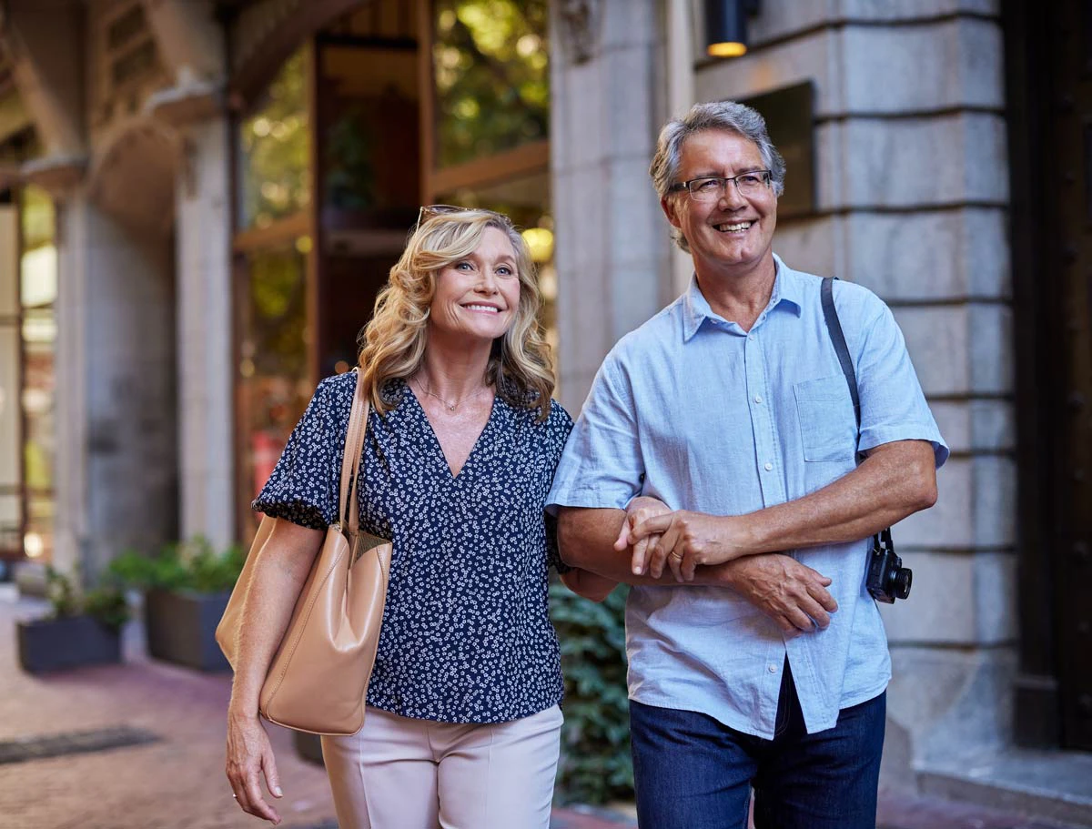 Older couple outdoors smiling