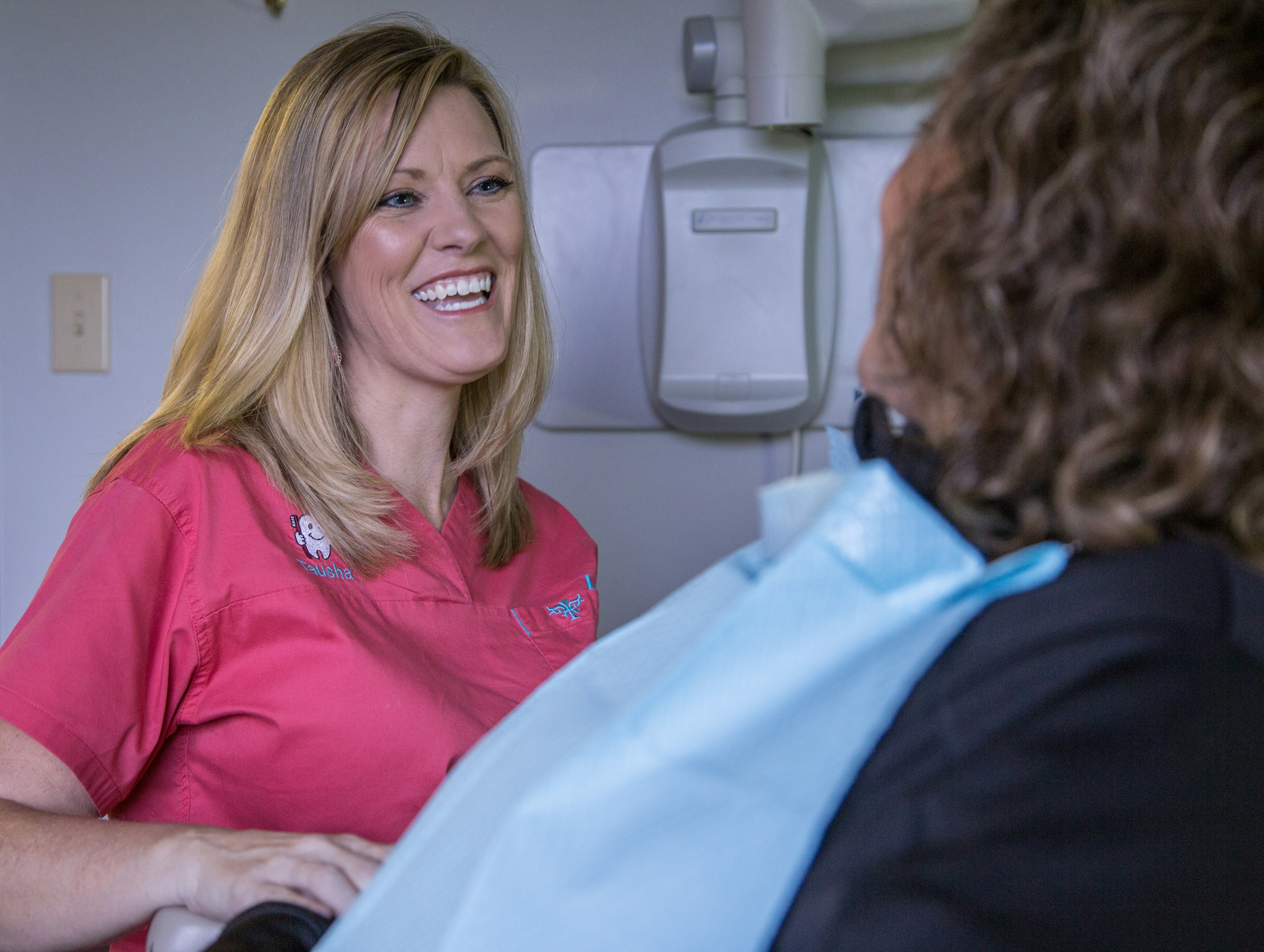 Tausha smiling at a patient