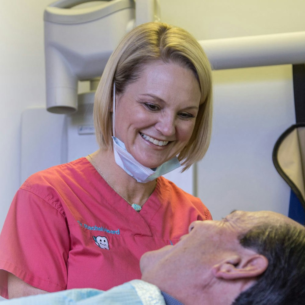 Dr. Heard smiling with a patient