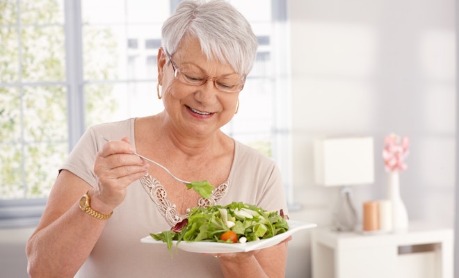 Senior woman eating a salad