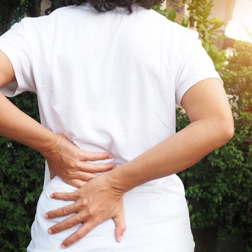 Woman resting hands on back