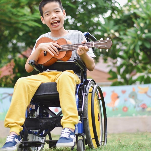 child playing ukulele