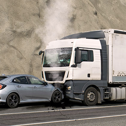 Aftermath of a truck colliding with a car