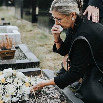 Grieving woman at the cemetary