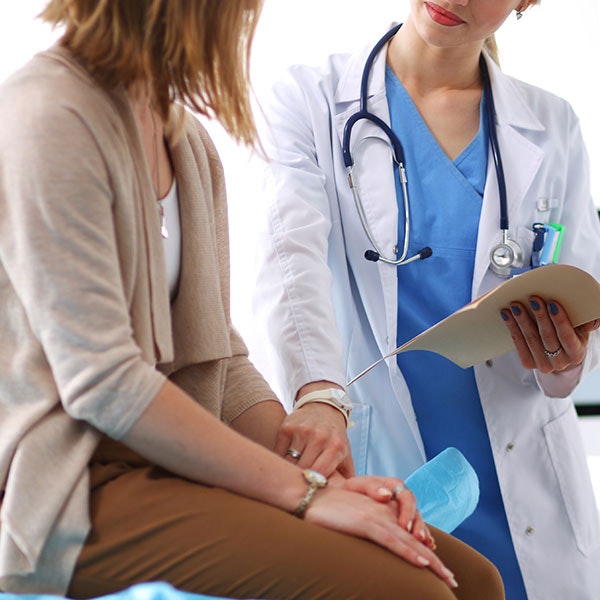 Doctor diagnosing patient